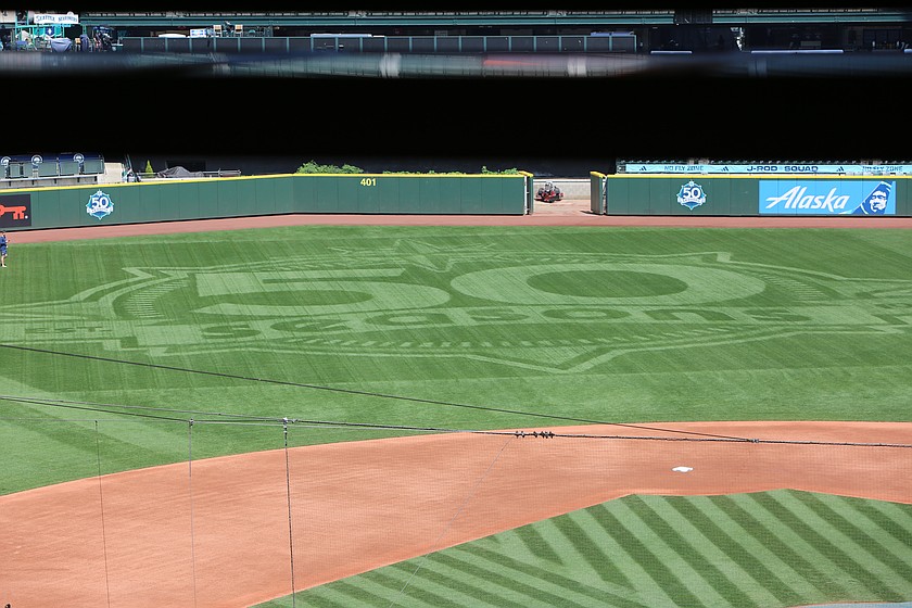 A 50 seasons anniversary logo is placed at the center of the outfield of T-Mobile Park. Desert Green Turf executed the installation of the logo ahead of the Mariners game against the Tampa Bay Rays, Friday.