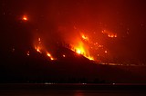 Wildfires burn across western US and Canada as residents are evacuated