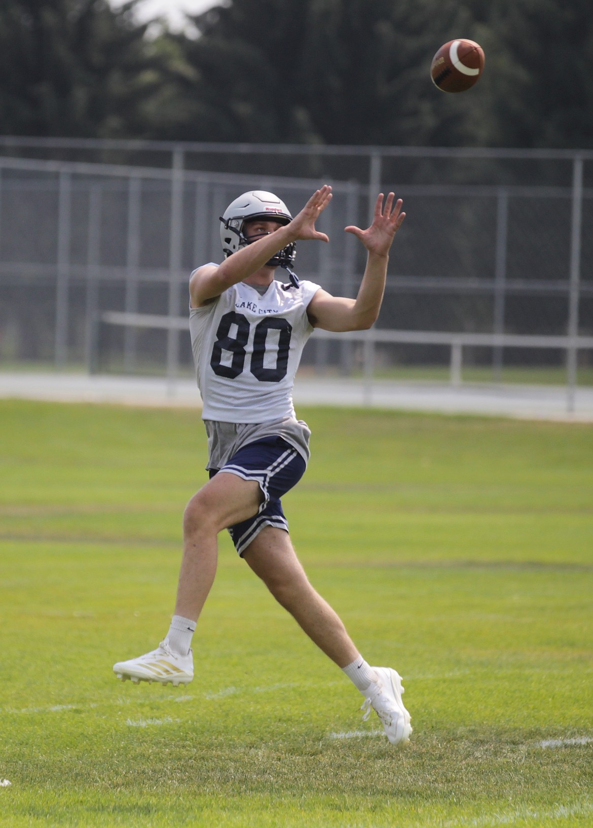 MARK NELKE/Press
Lake City senior Marek Parson hauls in a pass at practice Monday, the first day of practice for Idaho fall sports teams. The Timberwolves open their season Aug. 21 at Boise High.