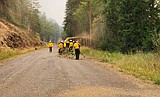 Crews continue fight against area wildfires