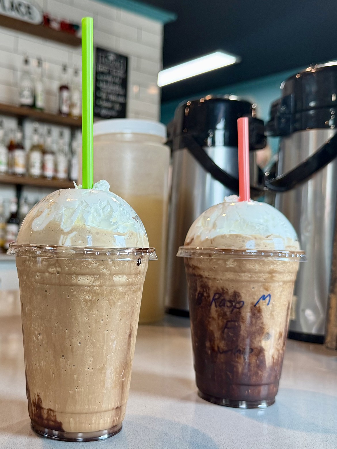 Two raspberry frappuccinos wait to be picked up by customers at the new Mason’s Place location. The new location will continue serving its signature drinks and baked goods but will be expanding to offer a breakfast and lunch menu in the near future.