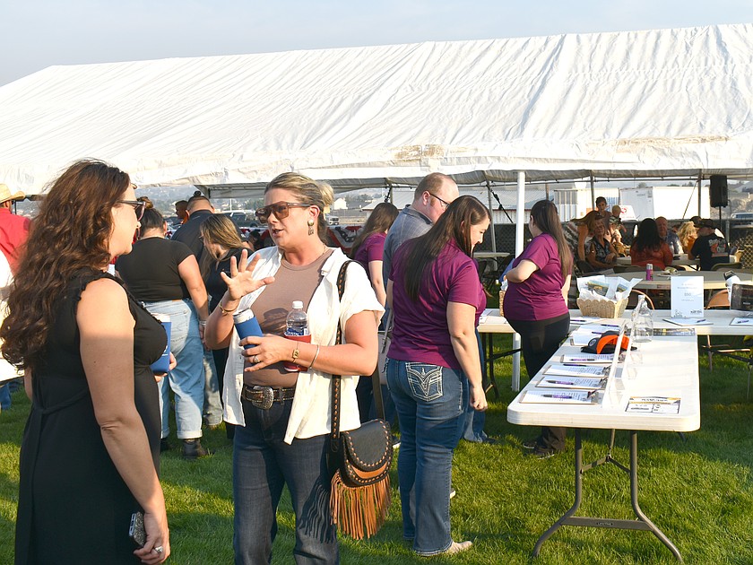 The Moses Lake Roundup Rodeo, which happens next week, kicked off Tuesday at the Moses Lake Chamber of Commerce’s Business After Hours, with dinner, raffles and a silent auction to benefit New Hope.