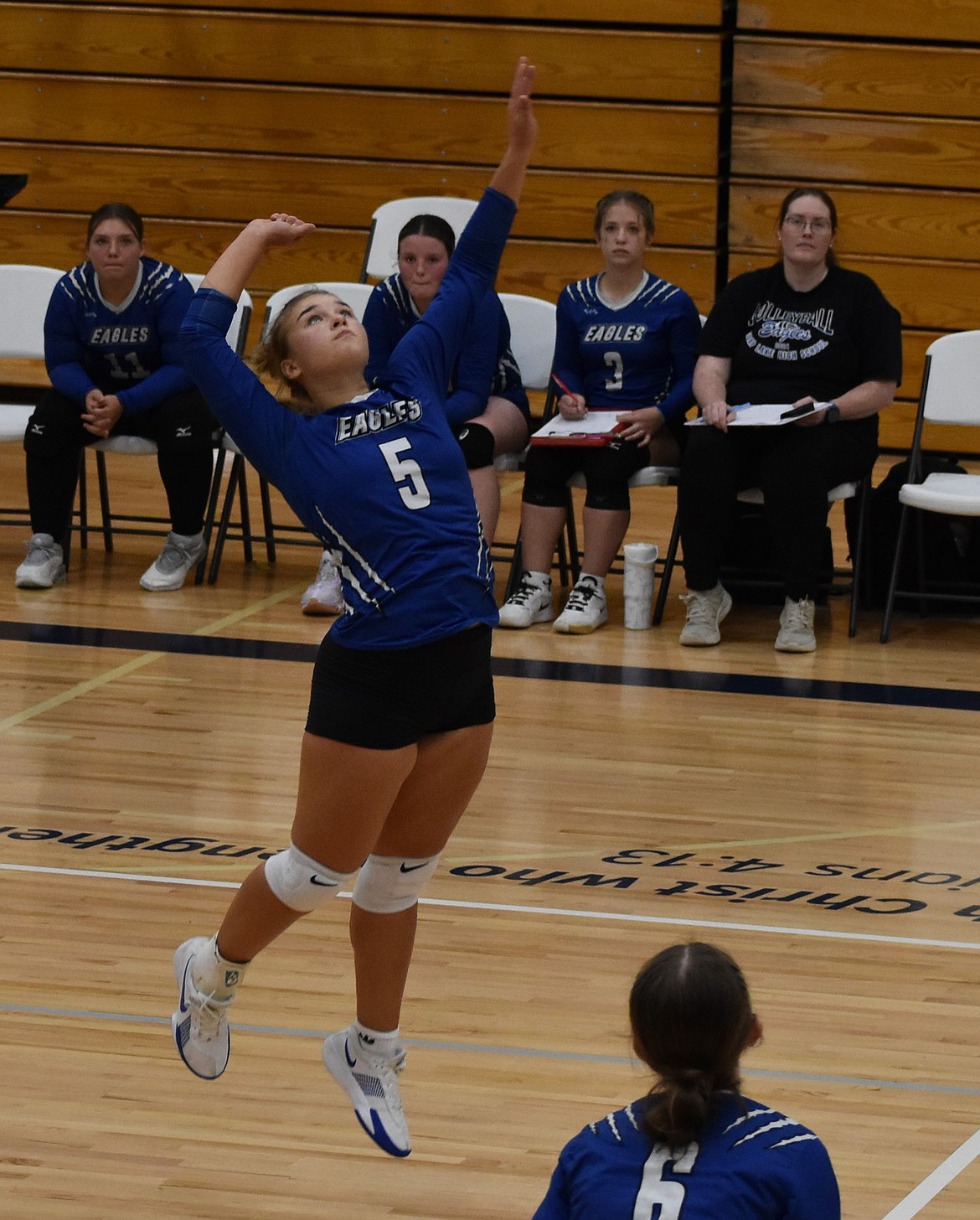 Playing for the Eagles last season, Liana Sushik leaps in the air to send the ball flying back toward the opposing Moses Lake Christian Academy/Covenant Christian School Lions.