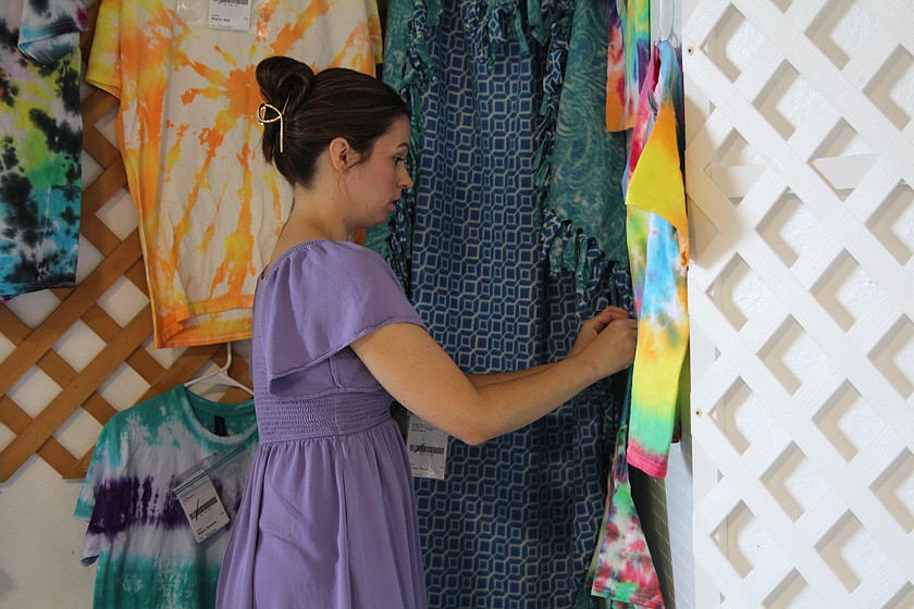 Heather McDowall hangs the entries in the fiber arts division at the Grant County Fair Monday. The 2026 fair starts today.