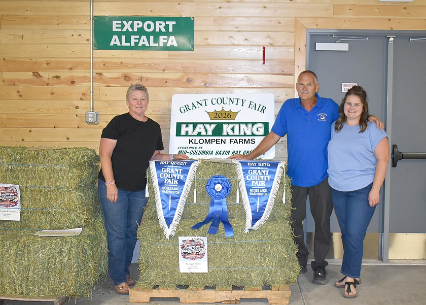 Anne Wieldraayer (left), and her husband Bob Wieldraayer, owners of Klompen Farms in Royal City, were named Hay Queen and King at the Grant County Fair Tuesday. Their daughter Erin Wieldraayer (right) helped with the cutting and baling to get the hay to the fair.