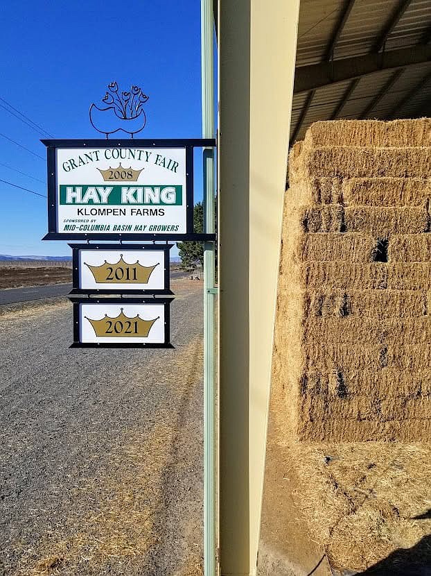 Klompen Farms has signs commemorating each of its wins in the annual Hay King competition, and will now have a fourth to add, after taking both first and second place this year.