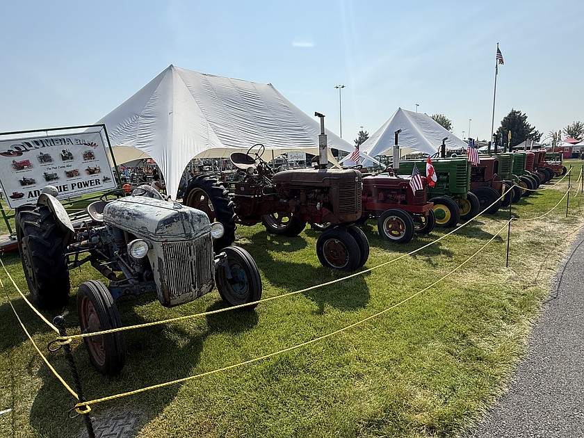 Tractors from the past line up at the Grant County Fair.