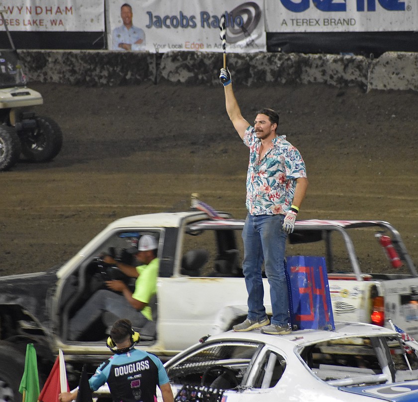 Kody Eilers stands proud atop his car after getting first in the winner’s race Tuesday night on the first night of the demo.