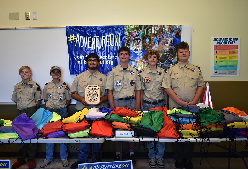 Boy Scouts give away bags of school supplies Monday as part of Francisco Guerra Campos’ Eagle Scout project. From left: Tucker Hardy, Jonathan Ostler, Guerra Campos, Colby Ostler, Parker Hardy and James Hardy.