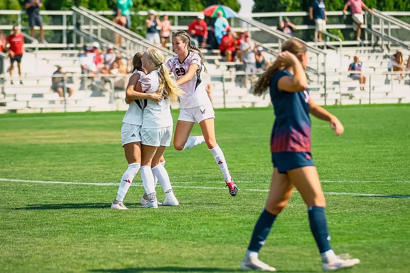 A trio of Eagles players celebrate after scoring a goal against Western Illinois. Eastern Washington is off to a historic 4-0 start to their season.