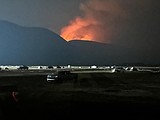 Crews battle storm-sparked fires