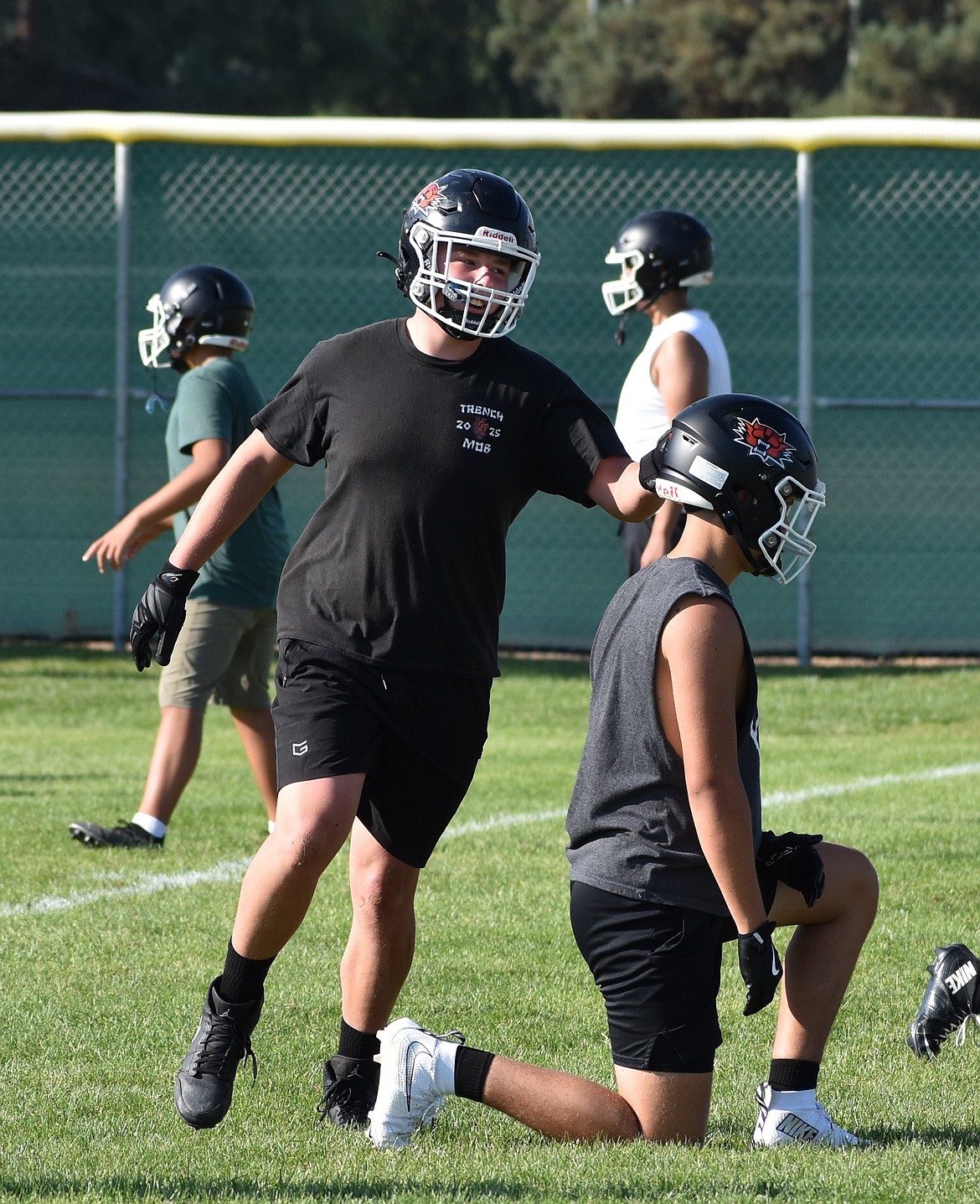 A game of duck duck goose turns into a tackling drill for Ephrata’s football team as Will Finch tags his teammate at one of their practices.