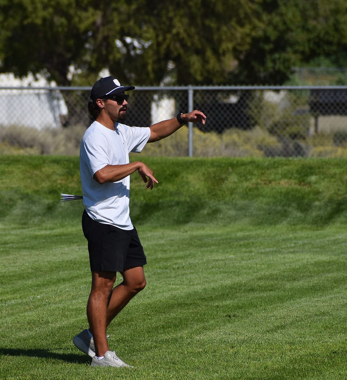 Tony O’Neel, Soap Lake’s new football head coach, motions to the players on what he wants them to do during practice.