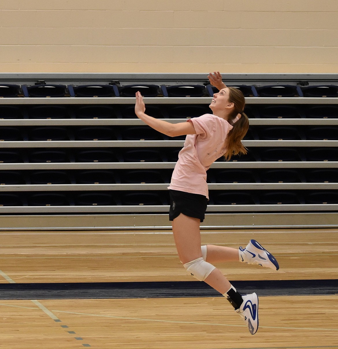 Big Bend sophomore Oaklee Woosley leaps up to spike the ball on the other side of the court during a practice drill.