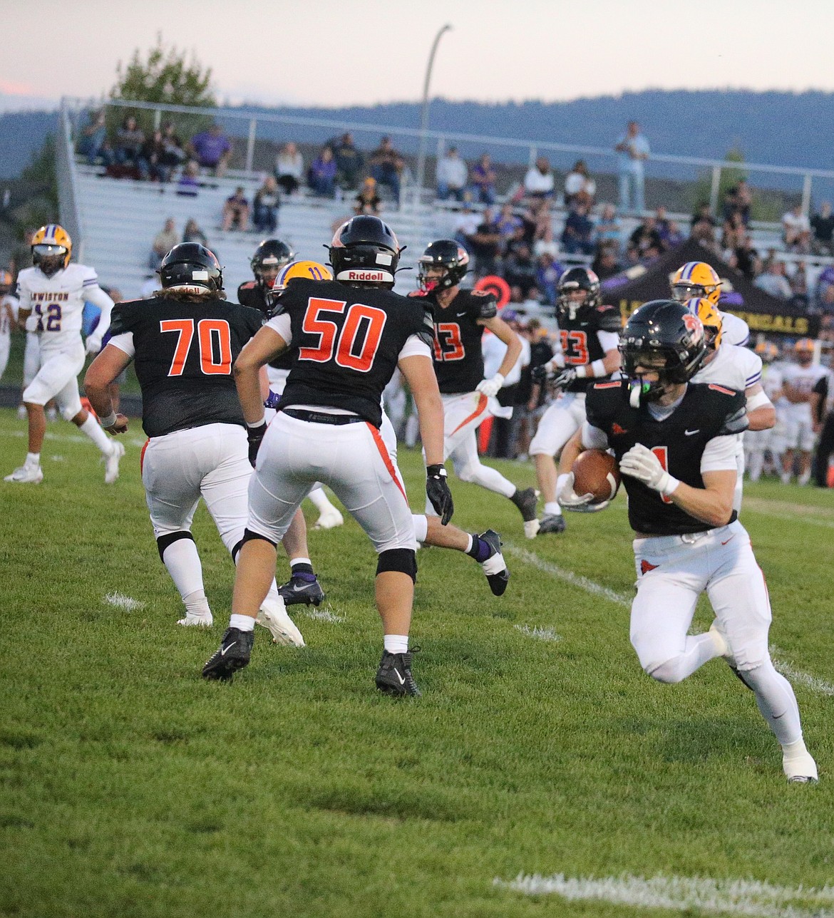 JASON ELLIOTT/Press
Post Falls senior wide receiver Cody Matthews breaks through the pack on his way to a 40-yard touchdown reception in the second quarter of Friday's game against Lewiston at Trojan Stadium.