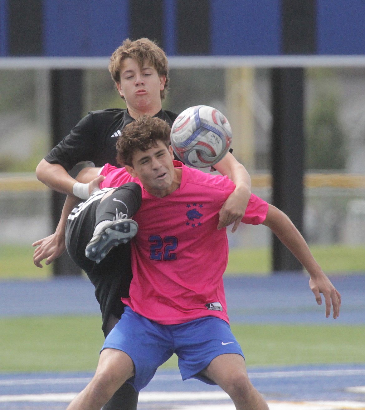 MARK NELKE/Press
Coeur d'Alene junior defender Jackson Duvall (9) and Timberline junior forward Cooper Ellis (22) vie for the ball Saturday at Viking Field.