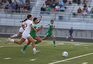 Emiko Kondo (8) from the Jacks races a Mavs player to the ball during their game on Tuesday. The Jacks were victorious 2-0 behind two goals by freshman Allanah Longwill.