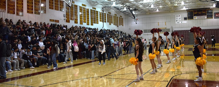 Moses Lake High School students pack into the gym for the first day of school assembly. They are welcomed by the Mavs Cheer Team.