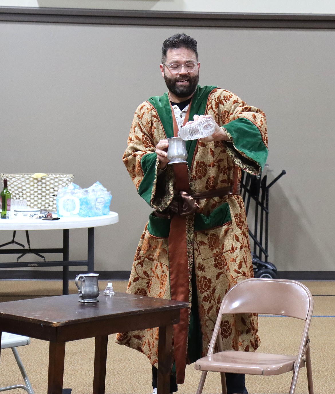 Cody Laun pours a drink in a Die Fledermaus scene rehearsed at the First Presbyterian Church in Coeur d'Alene, Sept. 2nd.