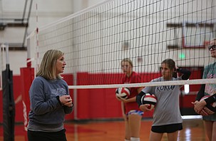 Head Coach Cari Galbreath (left) talks with her players at the Lind/Ritzville Broncos practice, Wednesday.