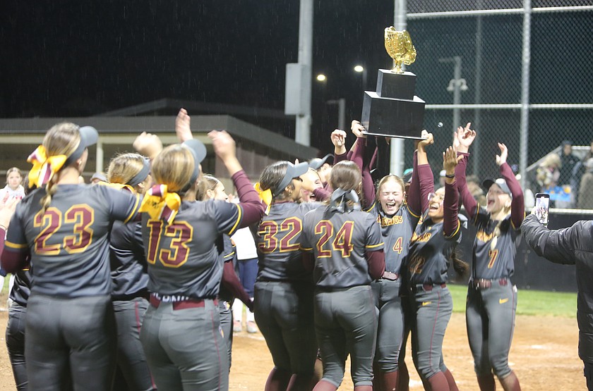 Samantha Kling (4) hoists up the 4A state championship trophy with her teammates after the Mavericks defeated the Chiawana Riverhawks 13-3 to win their first state title in school history, last season.