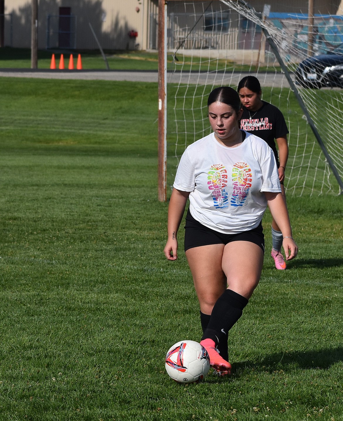 Huskies senior Aliyah Ruelas gets possession of the ball at practice early on in the season.