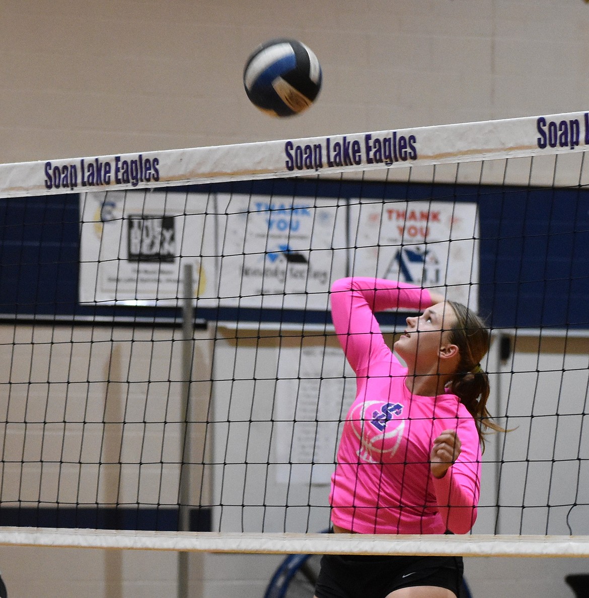 Soap Lake senior Janessa Knudsen prepares to hit the ball back over the net to her teammates during an early season exercise.