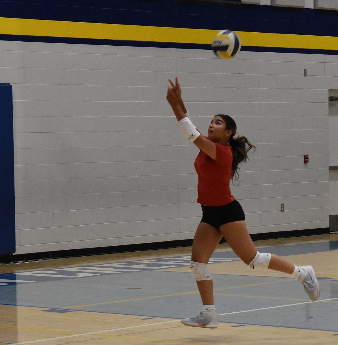 Devils senior Debi Horn during practice quickly responds to a hit from her teammates on the other side of the court.