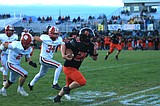 PREP FOOTBALL: Penalties doom Trojans against Sandpoint late