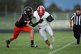 PREP FOOTBALL: Sandpoint escapes rollercoaster ride in Post Falls
