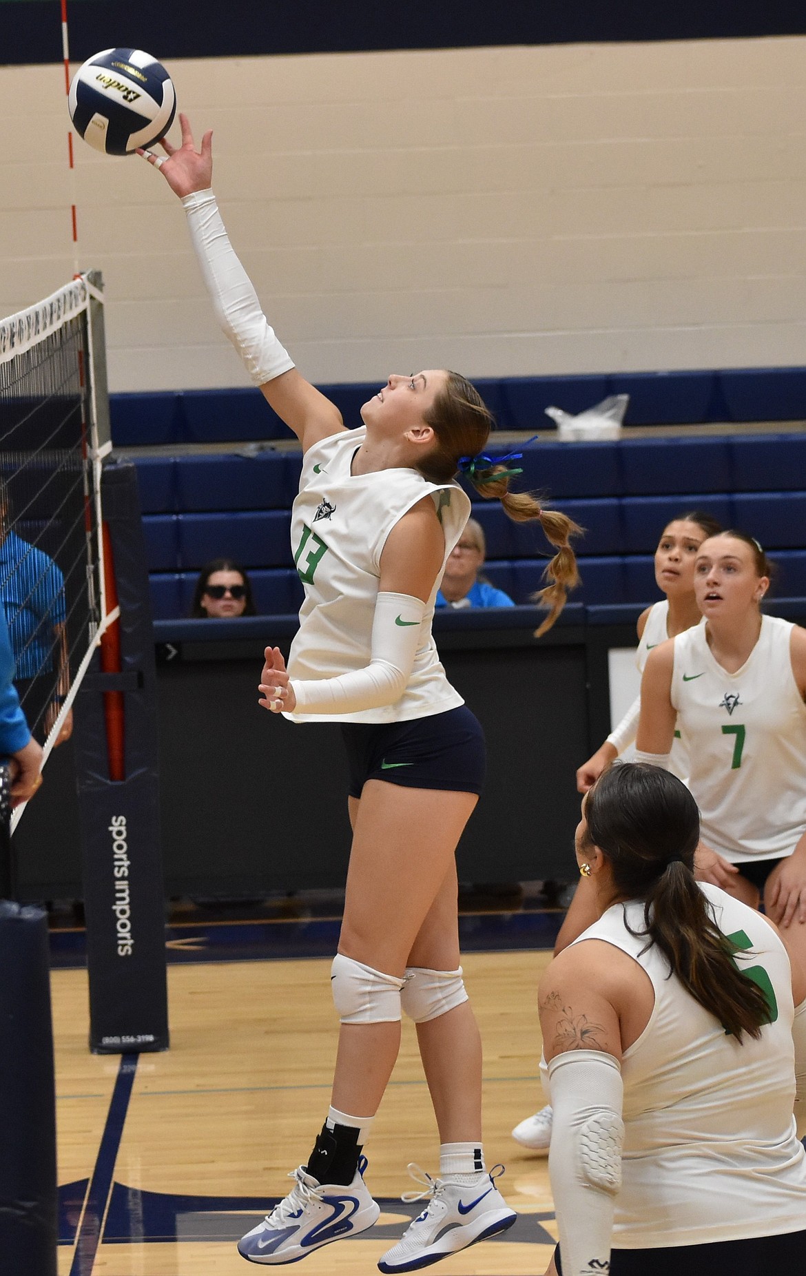 Oaklee Woosley from Big Bend tips the ball back over the net Friday afternoon against Highline.