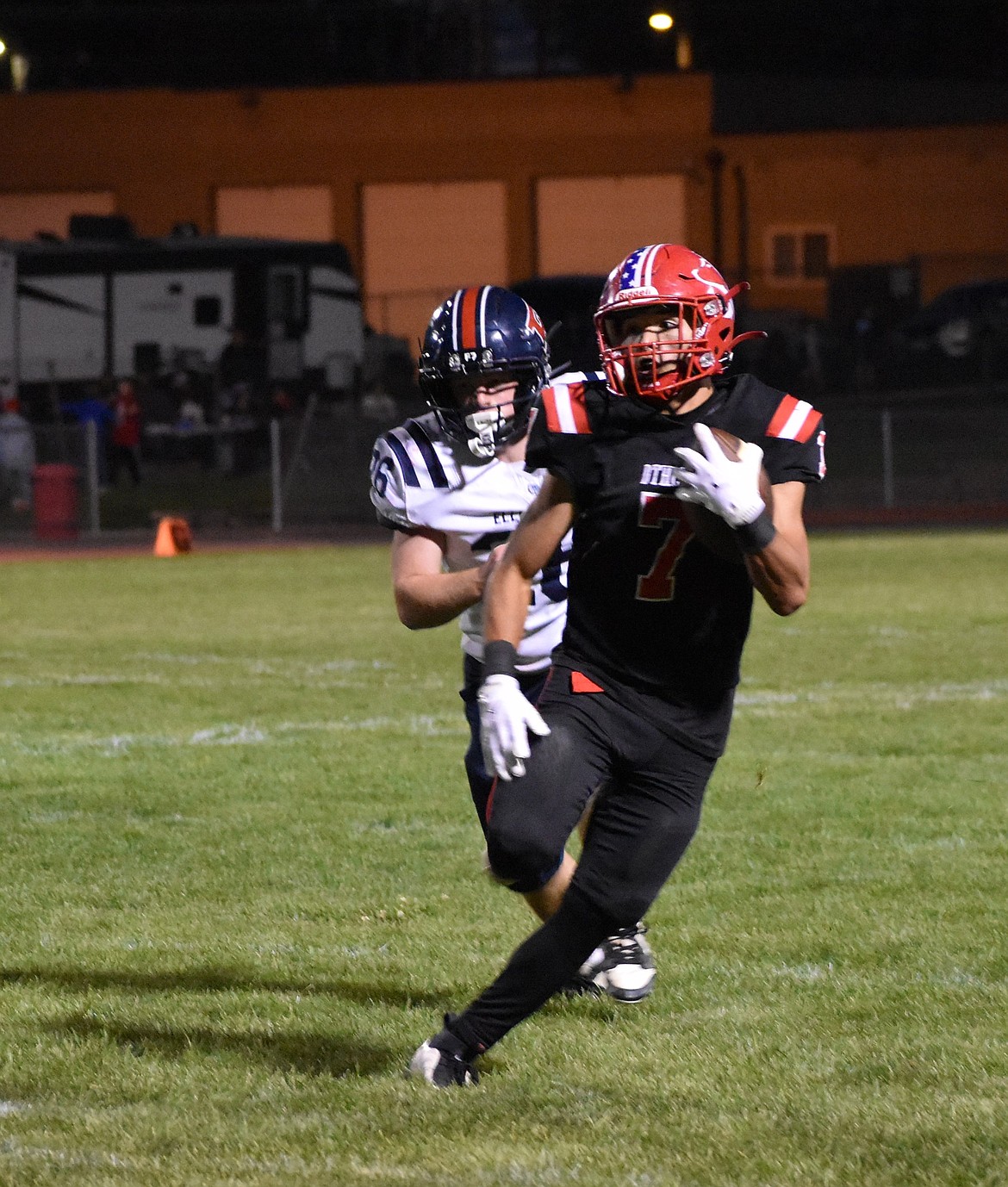 Cain Gonzalez, a junior running back from Othello, sprints past the Ellensburg defense to gain a first down Friday night.