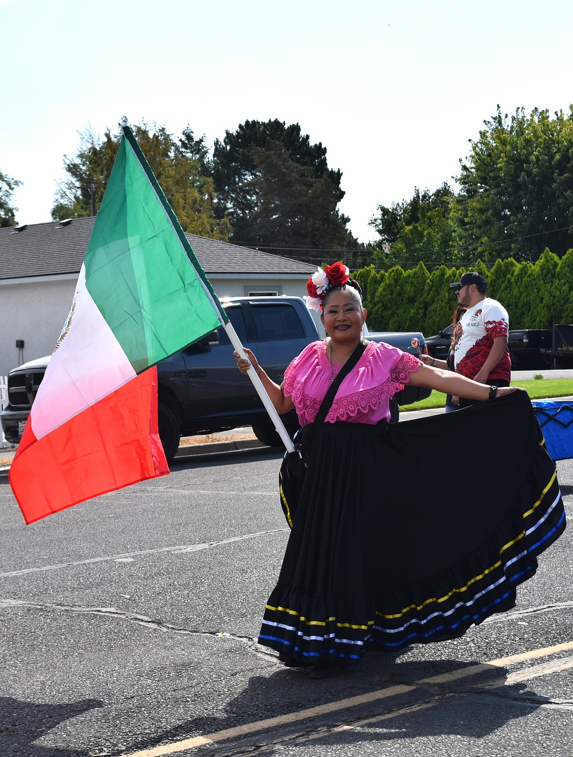 A Ballet Folklorico dancer spins through downtown Warden Monday, bringing color and culture to the annual Community Days parade.