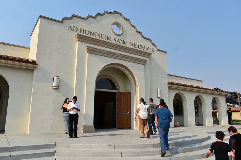Parishioners outside the door of the remodeled Holy Cross Catholic Church in Mattawa. The church’s parish festival was at the center of an extensive discussion at the Sept. 3 Mattawa City Council meeting.