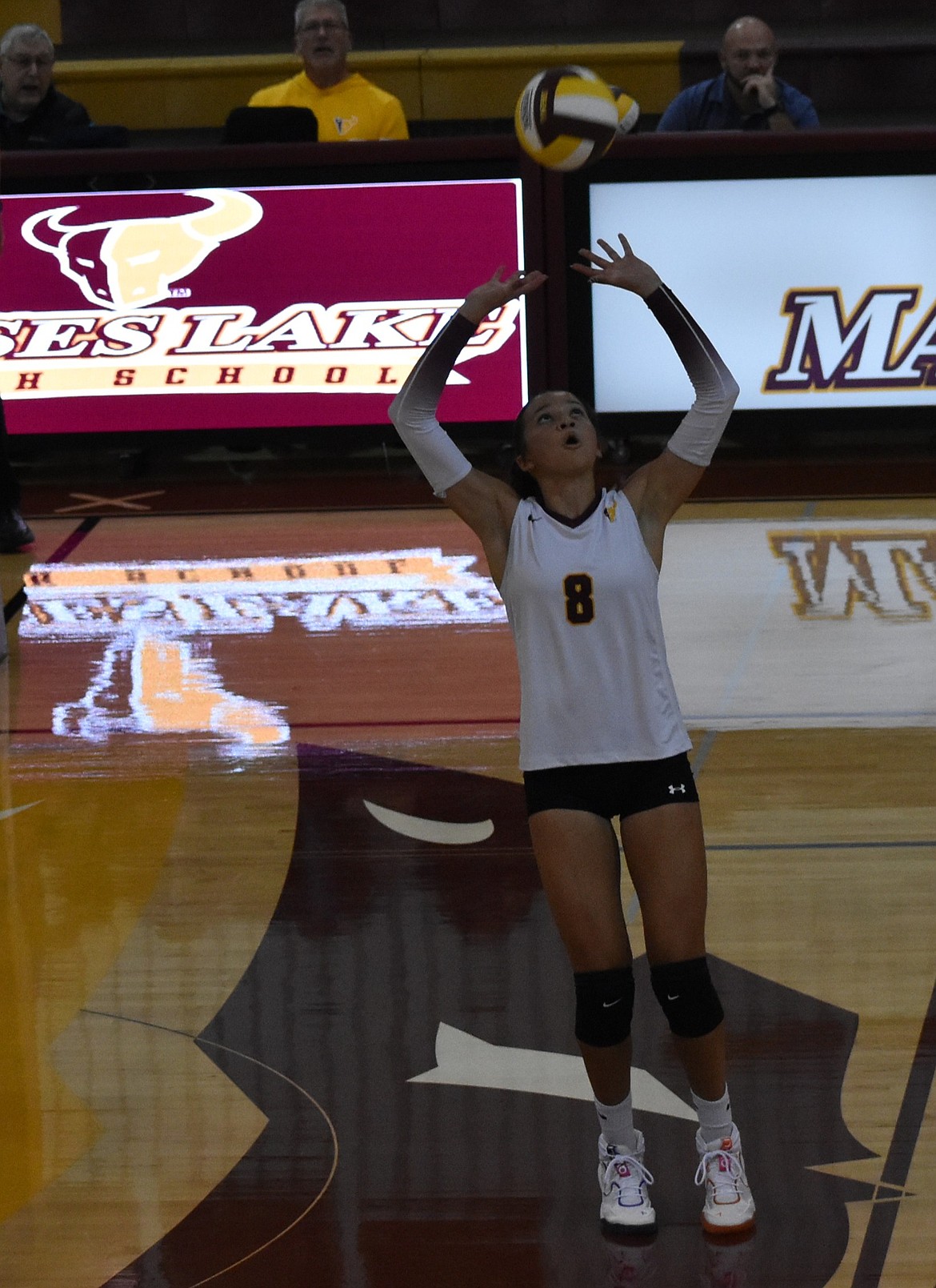 Mavs junior Allison Bond leaps up to set the ball for her teammate against the Tigers Tuesday evening.