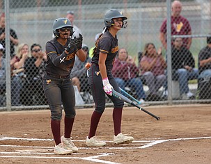 After scoring a run, Mya Martinez (22) encourages her teammate who made got to first and recorded the RBI. The Moses Lake Mavericks are 2-0 after sweeping Sageview at home.
