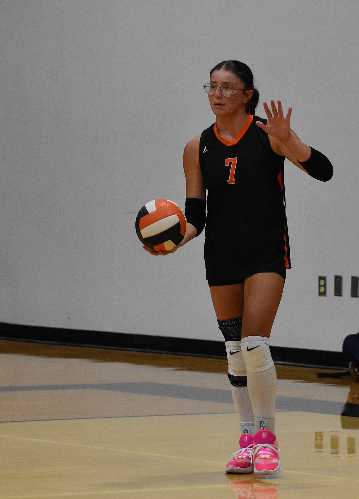 Addison Vasquez from the Tigers prepares to serve the ball in Thursday’s home game against the Huskies.