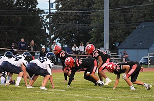 The Othello Huskies defense lines up against their opponent during their week one matchup at home.