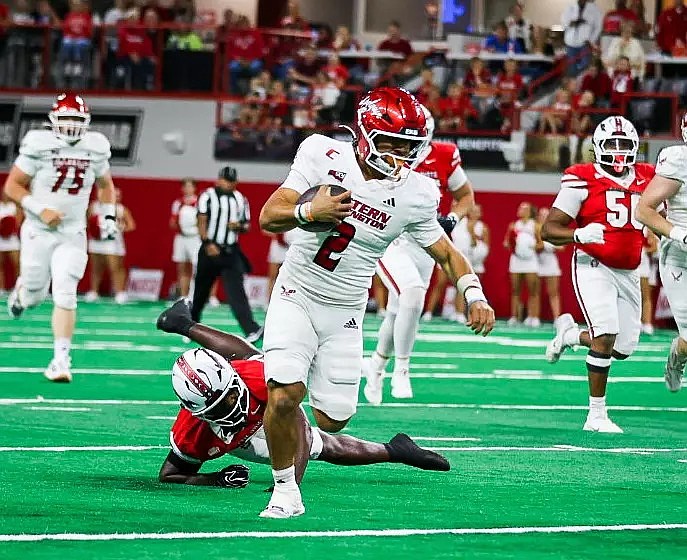 Nate Bell (2) leaves a defender behind while scrambling from the pocket for an offensive gain against South Dakota on Saturday.
