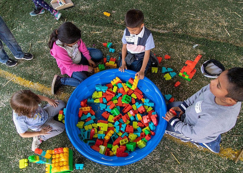 Children hangout at the Kid Zone at the Othello Fair, which is for children ages 7 and younger.