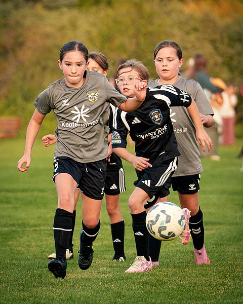 Photo by SEAN MARKS
The Sting 16/17 Girls Black soccer team traveled to Sandpoint over the weekend to compete in the Pend Oreille Cup. The Black squad finished the tournament with a 1-2 record. Pictured: Sting player Abigail Frank outruns defenders to the ball during play at the Pend Oreille Cup.