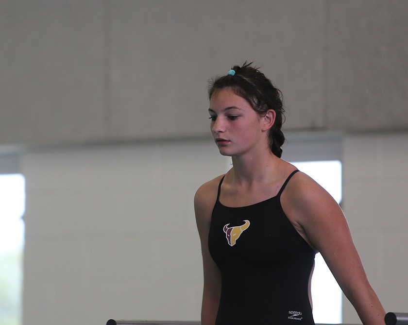 Taylor McKay from the Mavs prepares to leap into the water during the season opening meet.