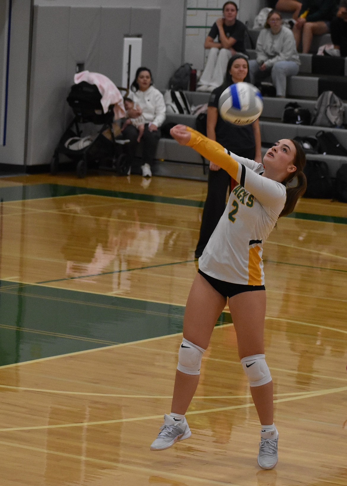 Karlee Weber, a junior from the Jacks, hits the ball back over the net against the Tigers.