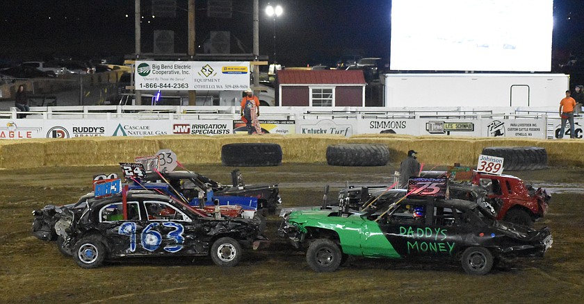 Demolition cars line up face-to-face ahead of the demo event Wednesday night as they cars prepare to battle it out for last man standing.