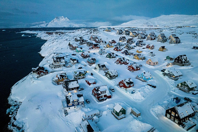 Houses covered in snow are seen on the coast of a sea inlet of Nuuk, Greenland, March 7, 2025. (AP Photo/Evgeniy Maloletka, File)