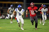 Lindquist shines on both sides; Stern accounts for four touchdowns as Coeur d'Alene overcomes illness, penalties, Sandpoint