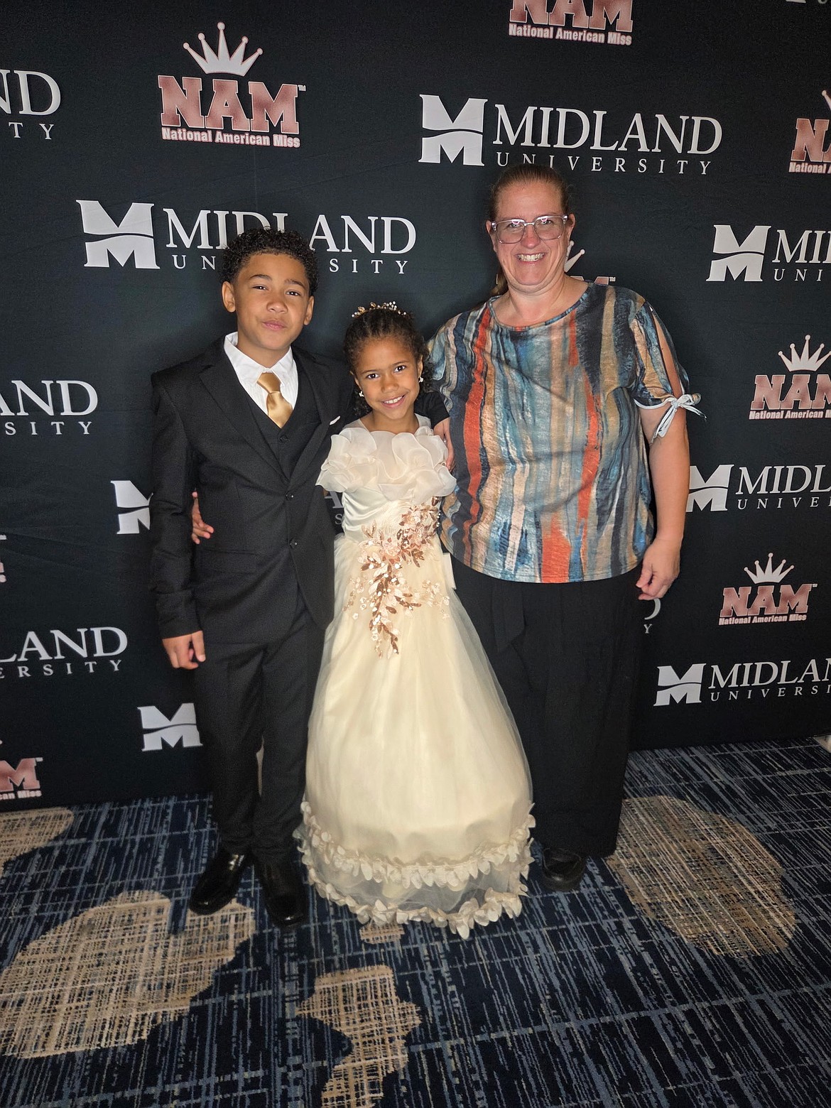 Emberlyn's brother, Westley (left) and mother, Anna (right) were very proud of her after her victory at the 2026 National American Miss state pageant in Bellevue, WA. over Labor Day weekend.