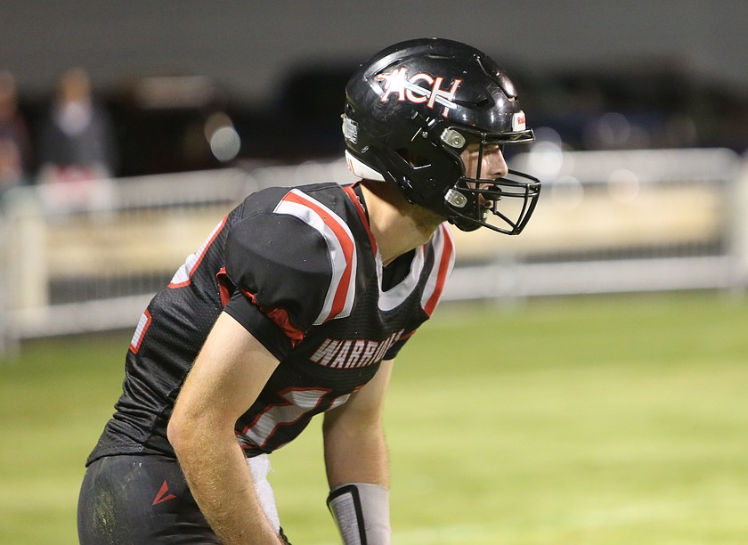 Almira/Coulee-Hartline’s quarterback Max Grindy (12) lines up in the secondary on defense for the Warriors against DeSales on Friday.