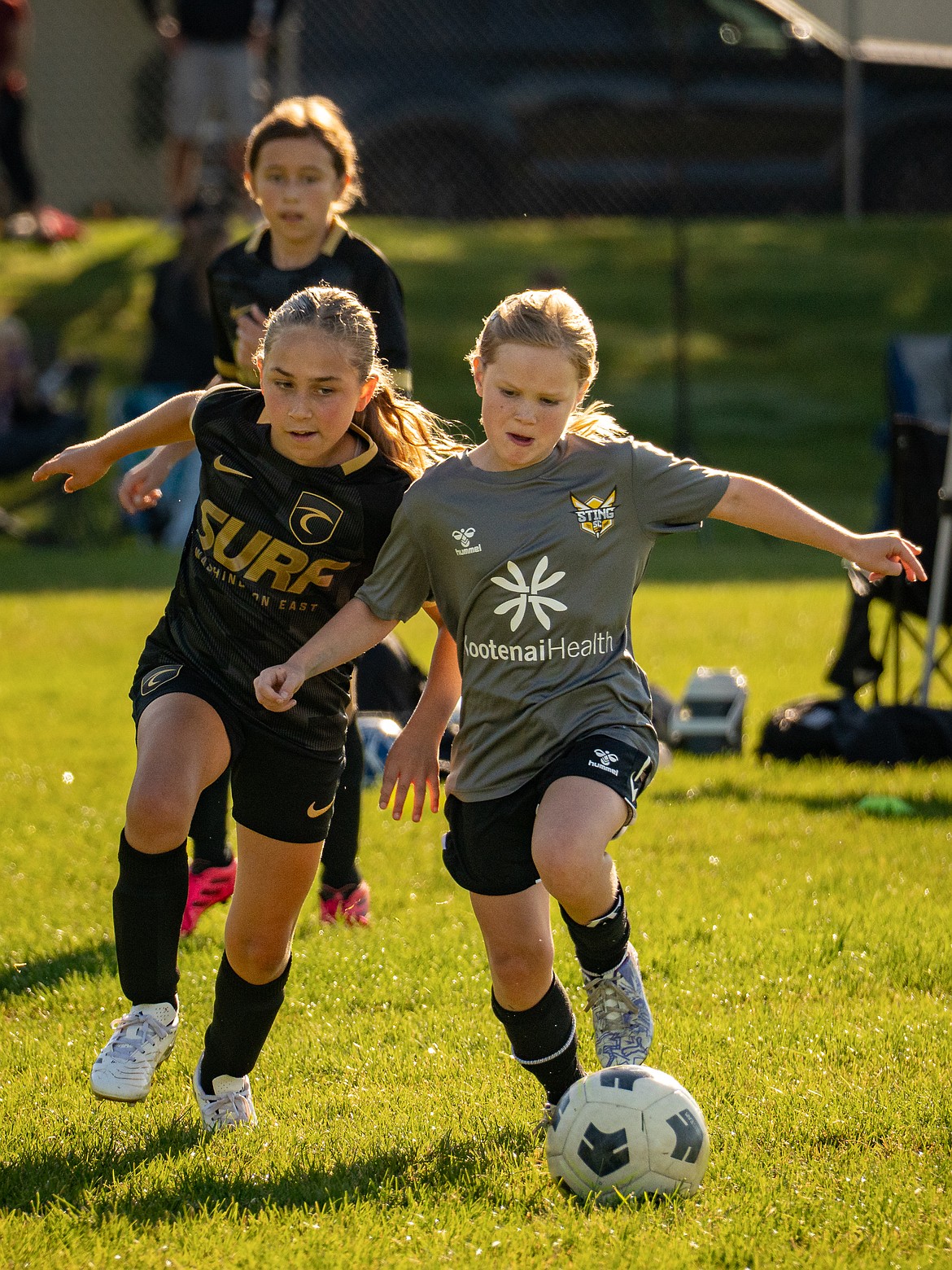 Photo by SEAN MARKS
The U10 Girls Sting Premiere Academy League soccer team dropped a 3-0 match against Surf on Saturday at the Canfield Sports Complex in Coeur d'Alene. Pictured is Lillian Shellman, right, of the Sting, fighting her way through the defense, creating a scoring opportunity.