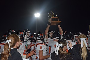 Ephrata's football and cheer squads gather in celebration as the Tigers raise their trophy for winning the 2026 Battle of the Basin.